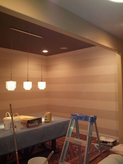 freshly painted striped design on walls of contemporary dining room