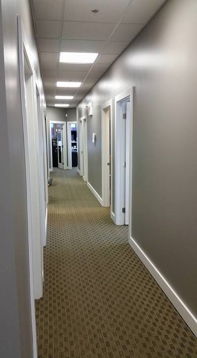 office hallway painted grey creating a corporate atmosphere