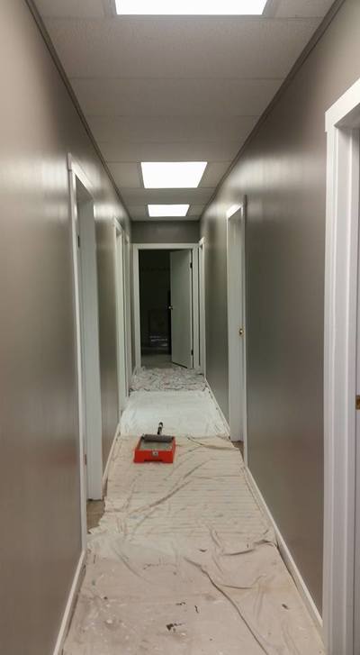 hallway with freshly painted walls showcasing the detail between wall and door frames