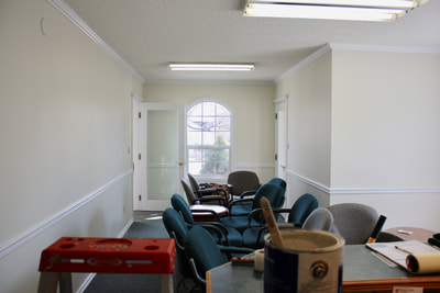 second floor area with a fresh coat of white paint, making the area bright and vibrant